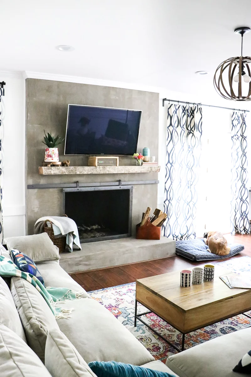 DIY concrete fireplace in colorful family room