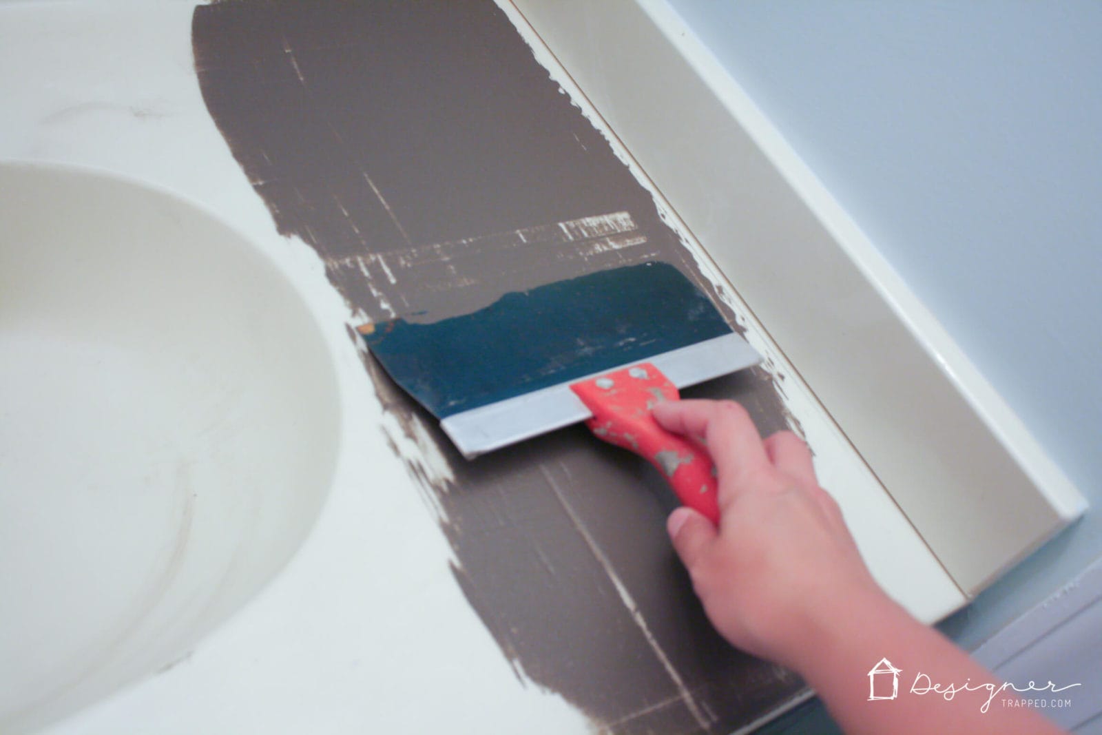 You can update your bathroom vanity without spending a fortune! This DIY vanity update using a concrete overlay with Ardex Feather Finish can be done for around $50 (including a new faucet). Check out the full tutorial!