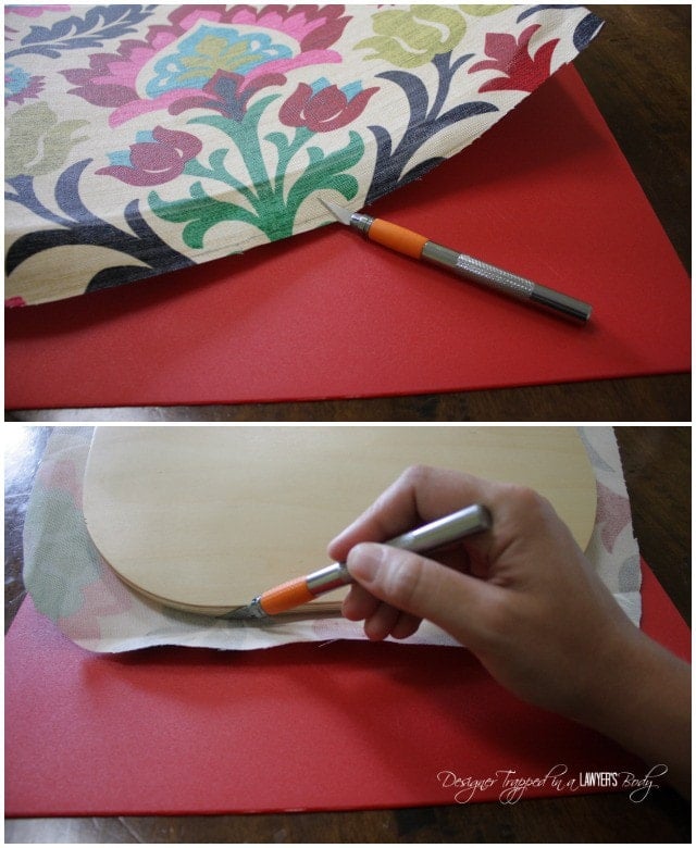 trimming away excess fabric after decoupaging fabric onto wood chair