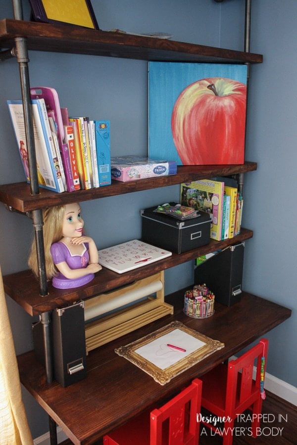 THIS IS AWESOME! This DIY pipe shelves tutorial includes built in desks--so original! Full tutorial by Designer Trapped in a Lawyer's Body.