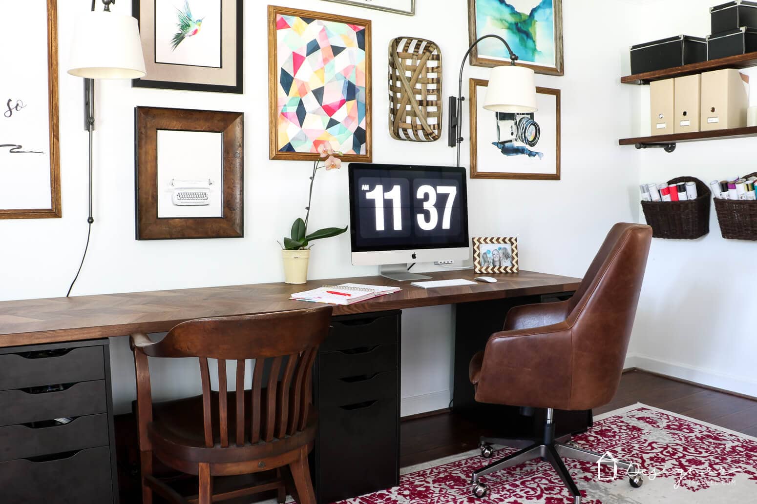 This IKEA desk hack uses a dark wood countertop on top of Alex drawers, a gallery wall and bookshelves. 