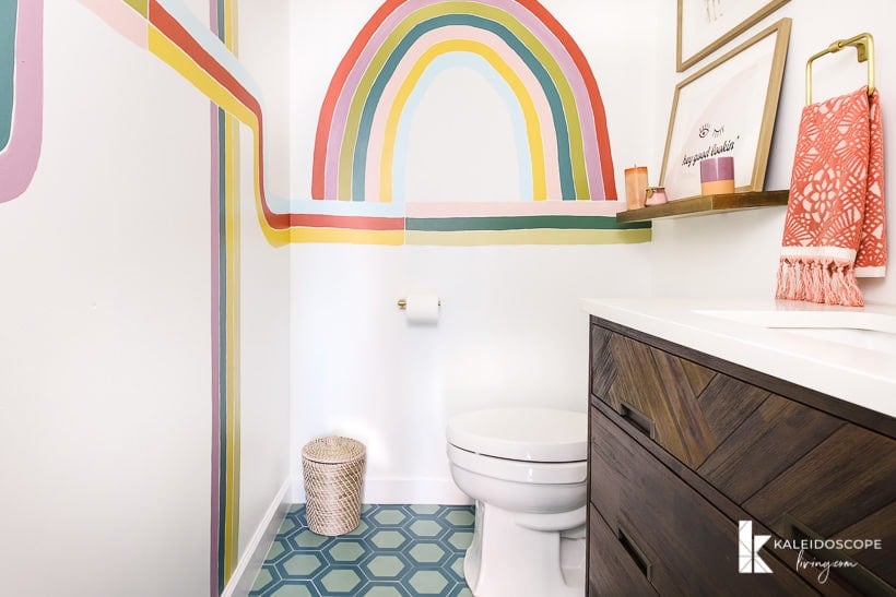 colorful powder room with cement tile and wall mural