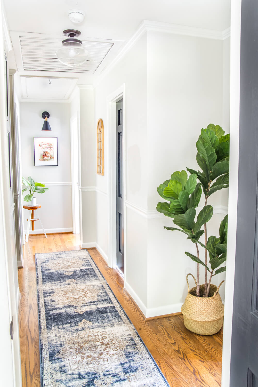 bright hallway makeover with blue rug