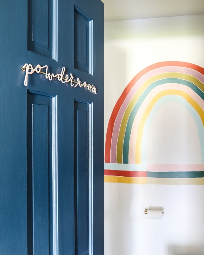 powder room with rainbow wall mural