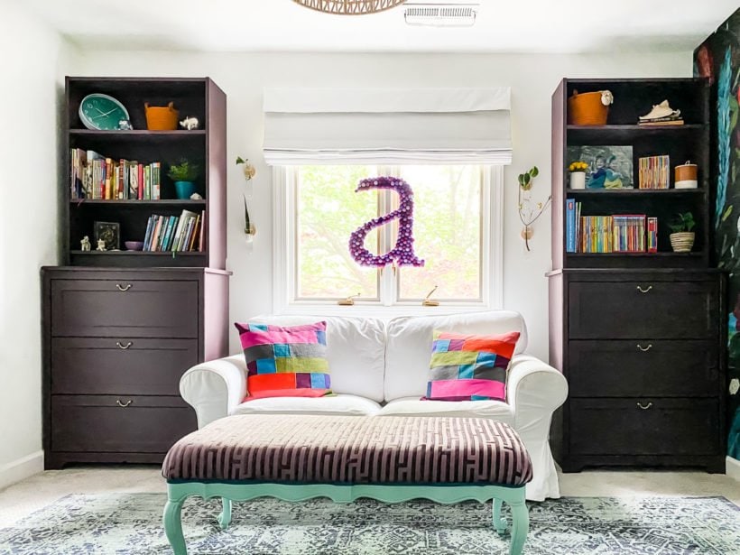 IKEA billy bookcases painted a deep purple color in girl's bedroom