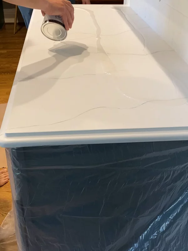 pouring epoxy resin topcoat on painted kitchen countertops by Tasha Agruso of Gadgetronicx