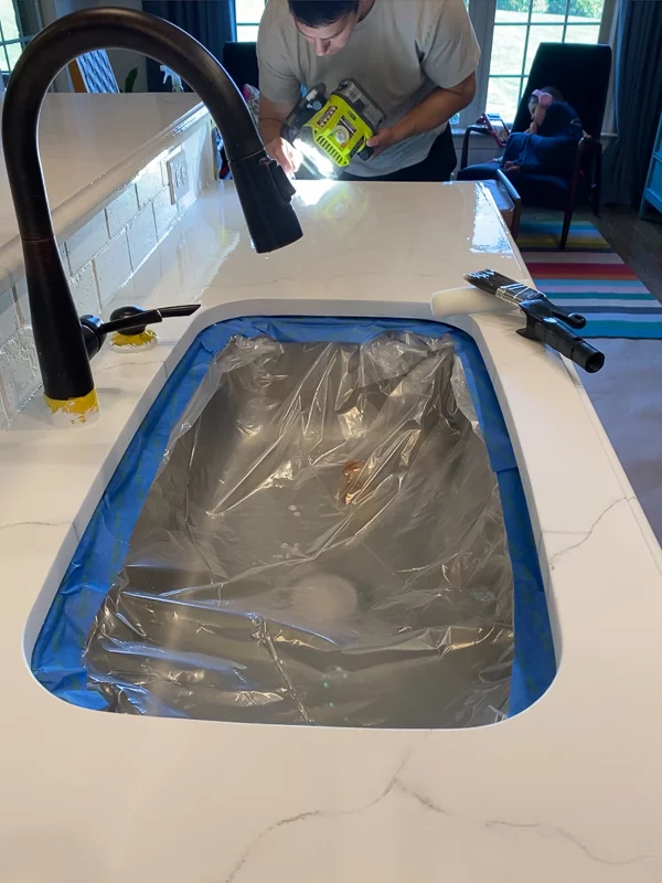 cleaning lint out of epoxy resin topcoat on countertops by Tasha Agruso of Gadgetronicx