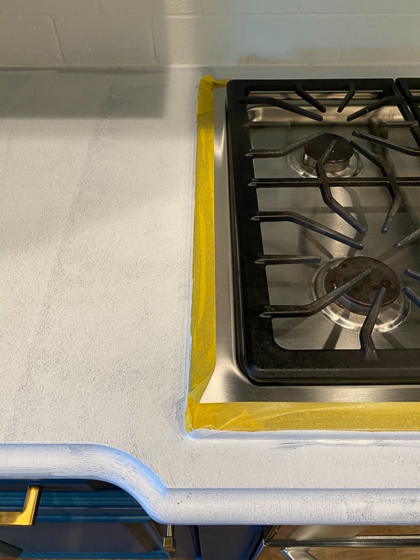 taped off stovetop for painting countertops by Tasha Agruso of Gadgetronicx