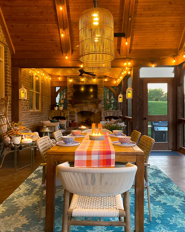 screened-in-porch with string lights at night