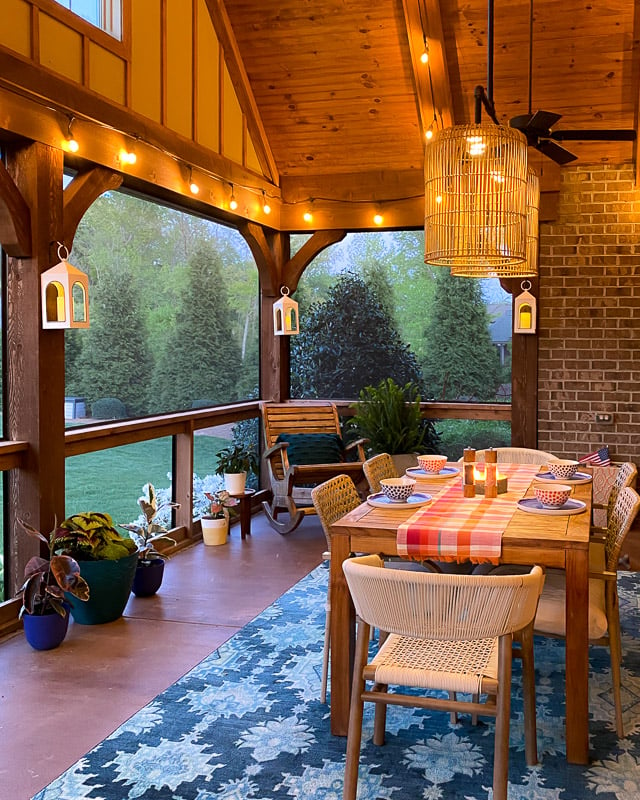 screened-in-porch with string lights at night