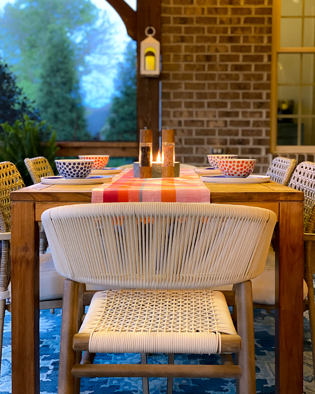 screened-in-porch with string lights at night