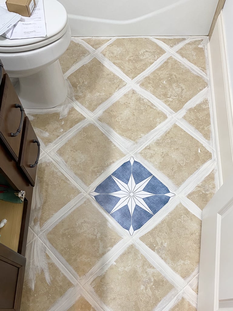 installing tile stickers on bathroom floor