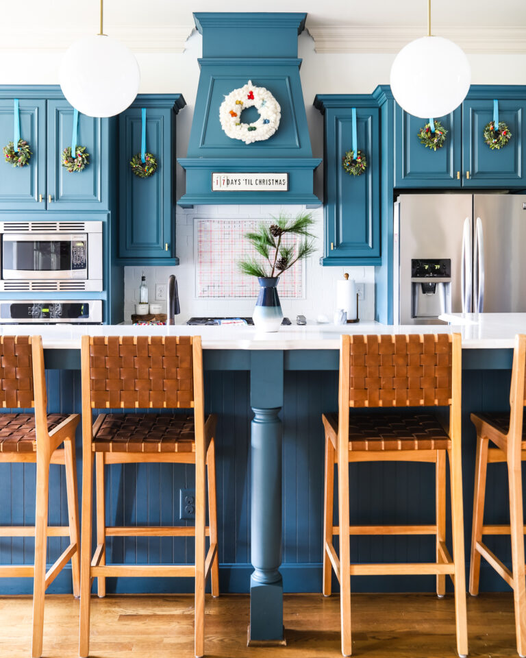 mini wreaths on blue cabinets