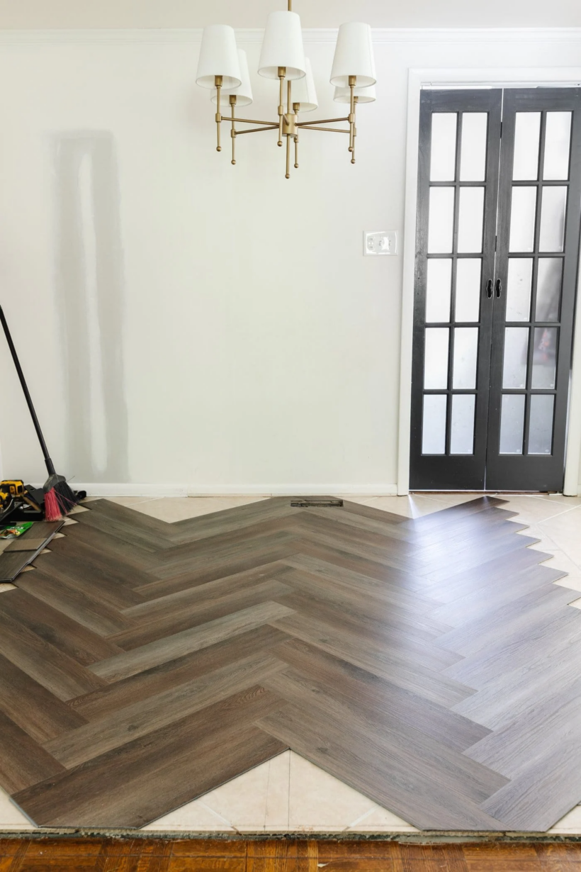 cheap luxury vinyl plank flooring installed in a herringbone pattern