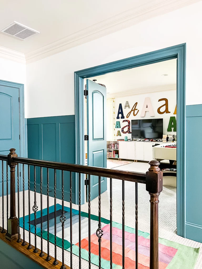 hallway with blue doors, trim and board and batten 