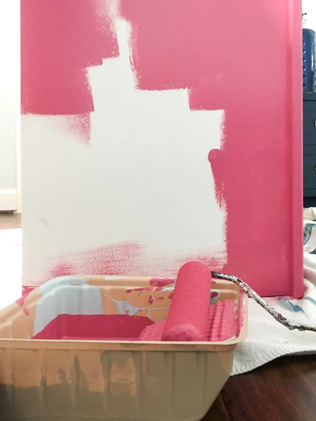 photo of a piece of IKEA laminate furniture being painted pink