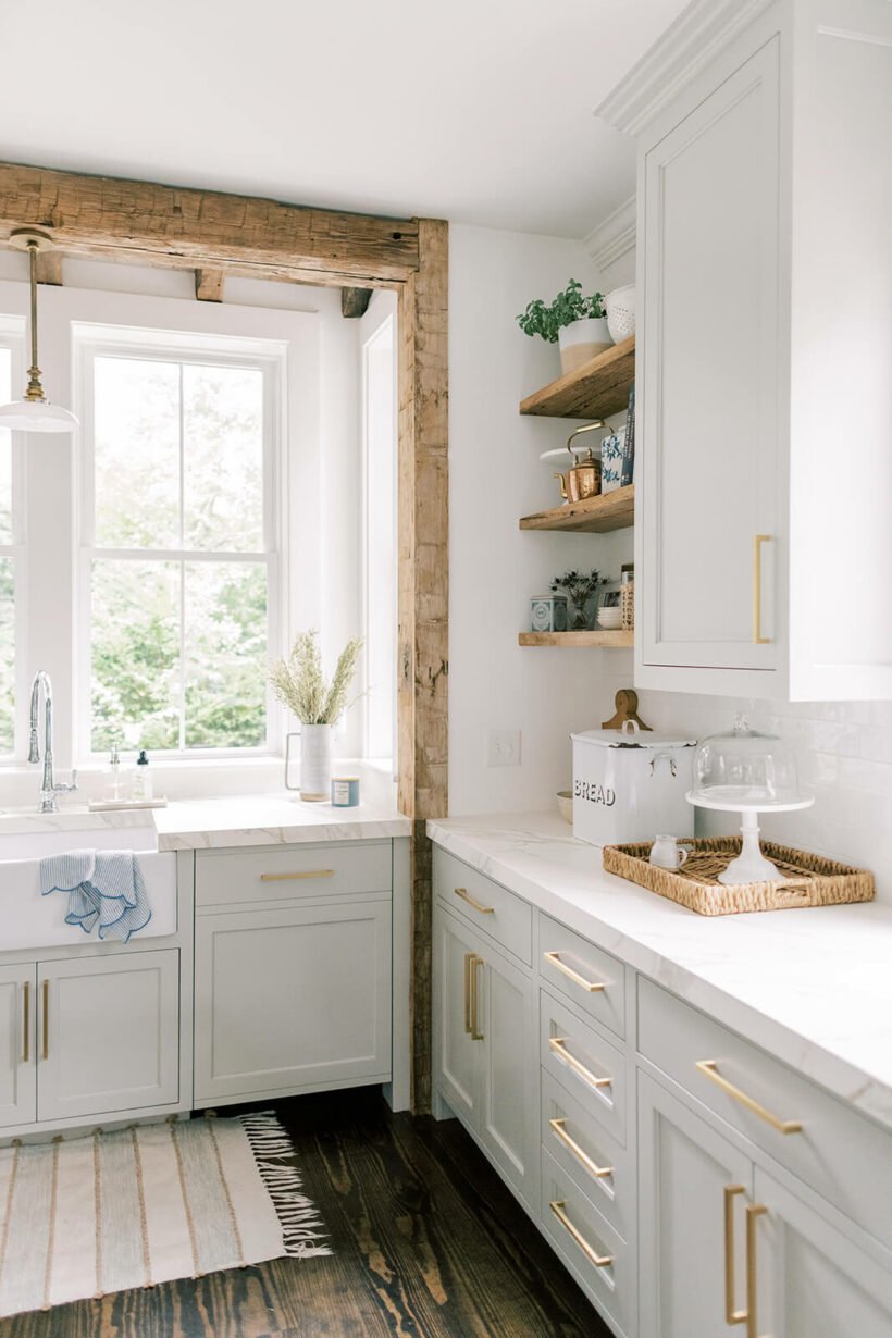 Sherwin Williams Repose Gray in bright kitchen with exposed wood beams and open shelving