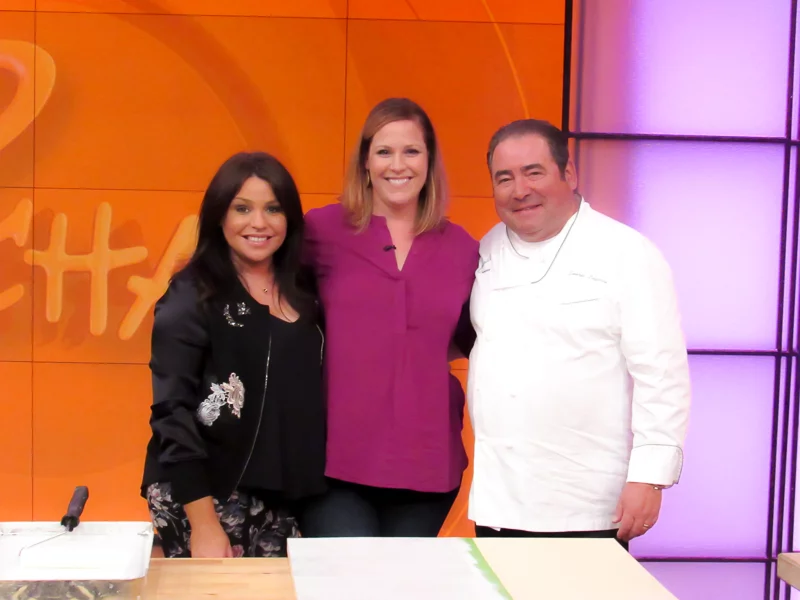 Tasha Agruso standing in between Rachael Ray and Emeril Lagasse