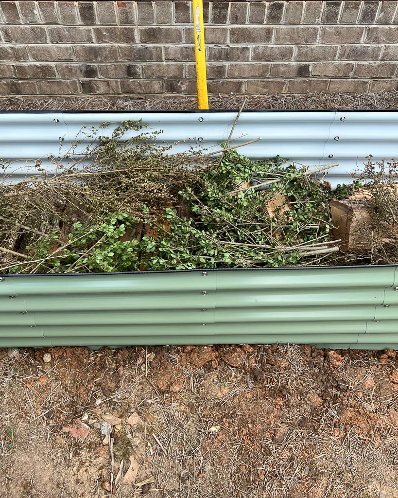 filling Vego garden bed using the Hugelkultur method