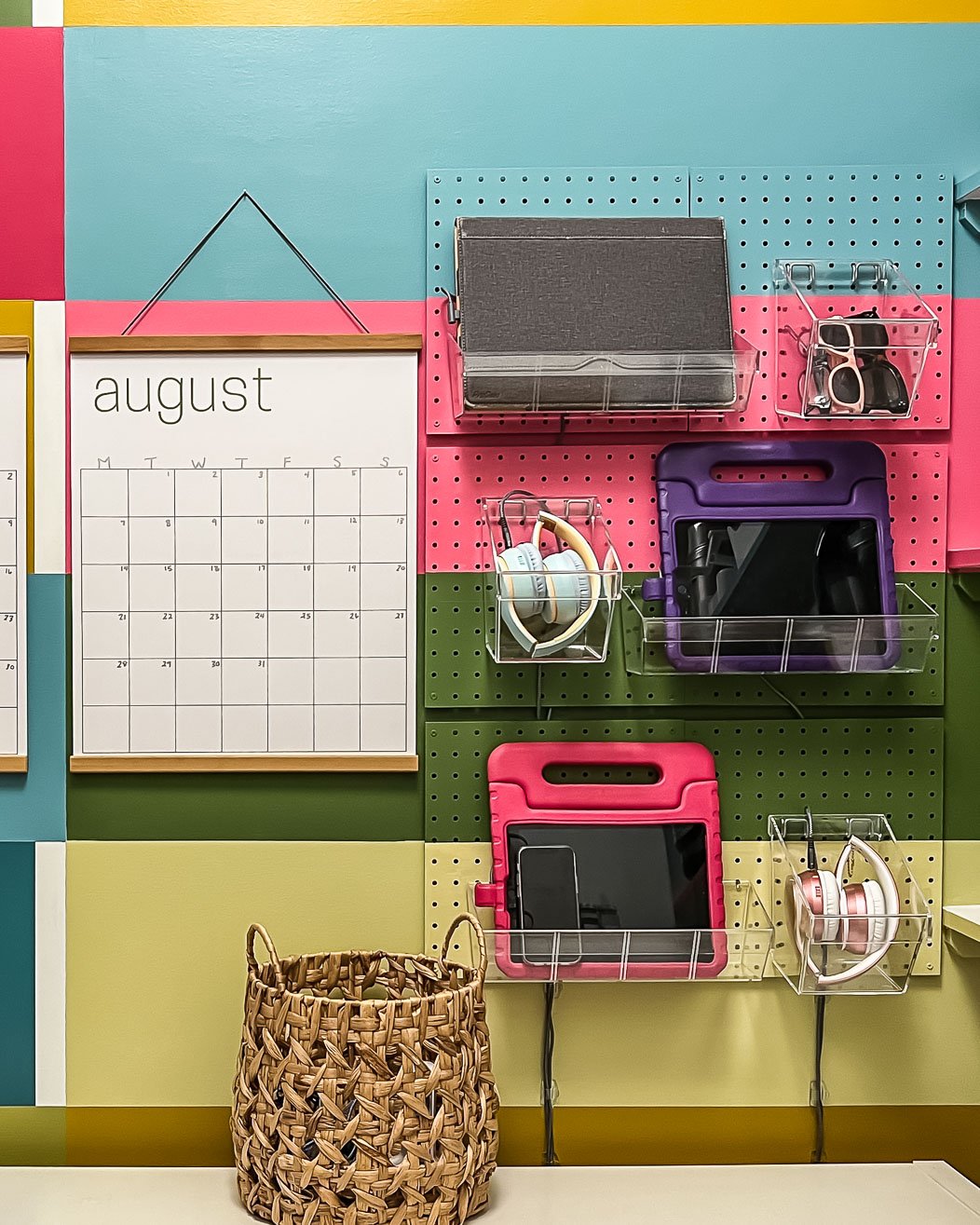 family charging station on wall mounted pegboard