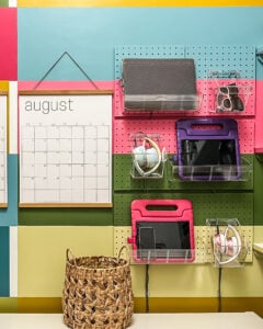 diy vertical family charging station using pegboard and acrylic bins for electronic devices