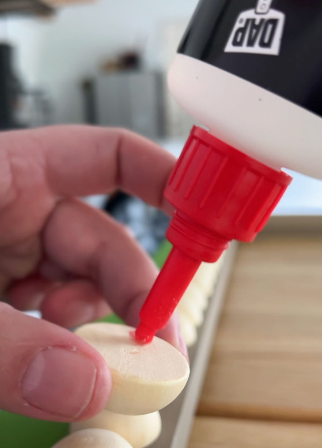 gluing wooden half balls on diy tv frame