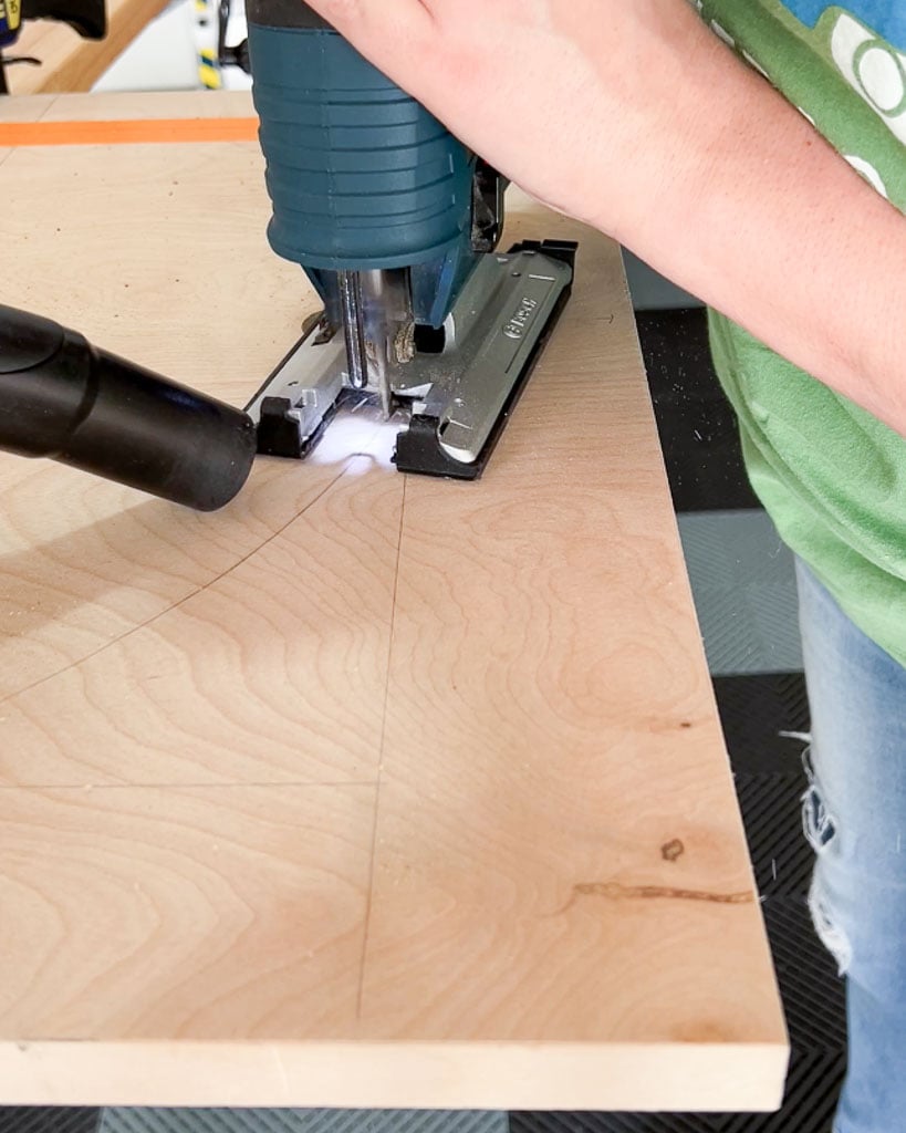 using jigsaw to cut arch out of plywood for DIY dog crate